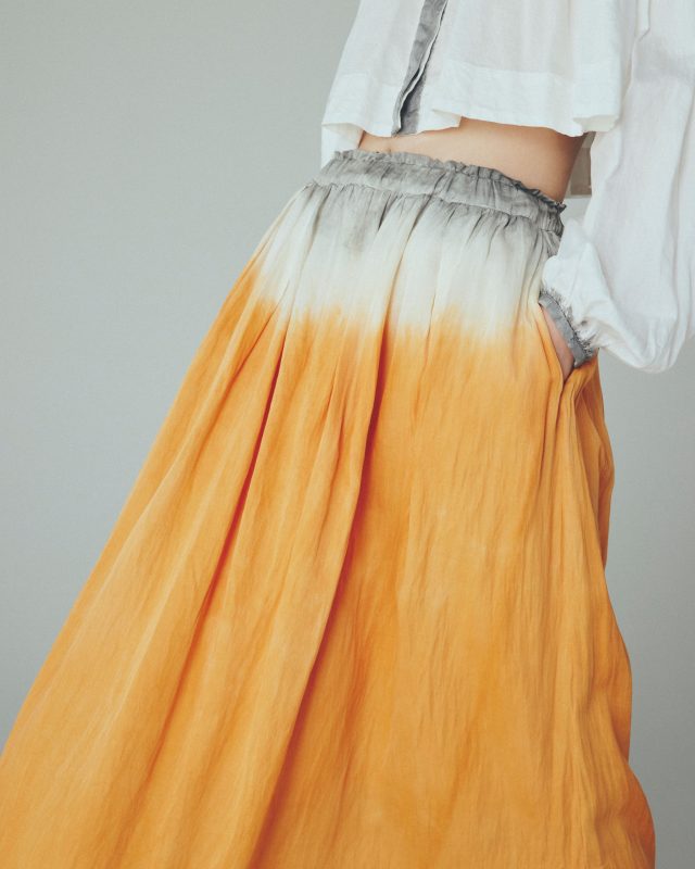<h6>Cotton satin Blouse with charcoal dye_pine charcoal-grey_BLOUSE 124-1<br />
Silk cotton satin Skirt with charcoal & soil dye _pine charcoal + soil orange_SKIRT 068-8</h6>

